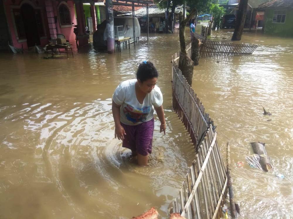Banjir di Desa Tanjung Burung, Kecamatan Teluknaga terdampak meluapnya sungai Cisadane, Jumat (26/4/2019).